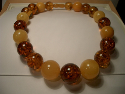 Massive multicolor amber necklace - round baltic beads