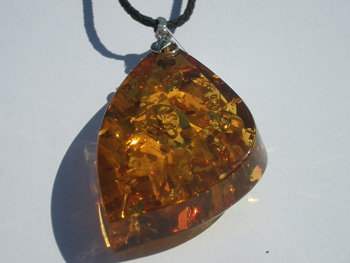 Cognac color Baltic amber pendant - on eather cord with 925 sterling silver mount