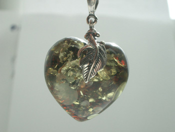 Natural green Baltic amber heart pendant with spangles.